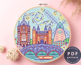 May include: Counted cross stitch pattern PDF for a colorful pixel art design of a bridge, clock tower, and buildings with a starry sky background. The text "COUNTED PDF pattern CROSS-STITCH" is in the lower right corner.