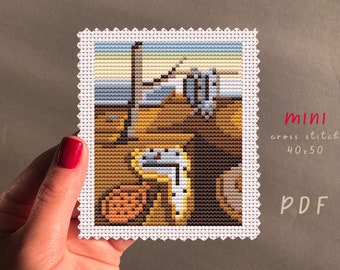 May include: A cross stitch pattern of The Persistence of Memory by Salvador Dalí, a surrealist painting featuring melting clocks. The pattern is 40 stitches wide by 50 stitches high. The pattern is labeled "mini cross stitch 40x50 PDF".