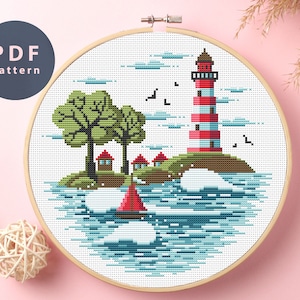 May include: Cross stitch pattern featuring a red and white striped lighthouse on a small island with green trees and a red sailboat in the blue water.