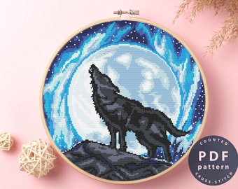 May include: Counted cross stitch PDF pattern of a black wolf howling at a full moon with a blue and white starry sky background.