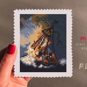 May include: A cross stitch pattern for a mini artwork featuring a sailboat on a blue and white background. The pattern is 40 stitches wide by 50 stitches high. The pattern is available as a PDF download.