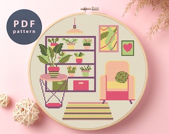 May include: Cross stitch pattern of a living room with a bookshelf, armchair, and a rug. The bookshelf is filled with plants in pots. The armchair is yellow with a pink cushion and a green pillow. The rug is striped in green, yellow, and pink.