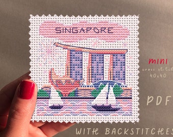 May include: A cross stitch pattern of the Marina Bay Sands hotel in Singapore. The pattern is 40x40 stitches and includes back stitches. The pattern is available as a PDF download.
