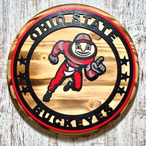 Officially Licensed Ohio State Buckeyes Brutus 12 in Rustic Round Wood Sign ManCave Sports Wall Decor w/ Back on Hanger 15" & 18" available