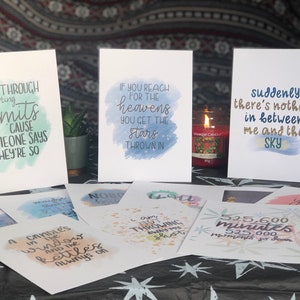 May include: A set of 10 watercolor prints with inspirational quotes. The prints feature a variety of colors, including blue, green, pink, and yellow. The quotes are printed in black ink and are easy to read. The prints are perfect for adding a touch of inspiration to any room.