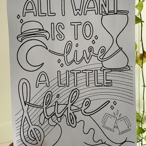 May include: Black and white colouring page with the text "All I want is to live a little life" with an hourglass, a crescent moon, a musical note, and two beer mugs.