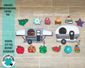 May include: A digital cut file for a camper van with interchangeable decorations. The decorations include a welcome sign, a camper sweet camper sign, a pumpkin, a shamrock, a watermelon, a flower, a candy corn, a snowflake, a Christmas tree, a campfire, a birthday cake, and a USA flag.