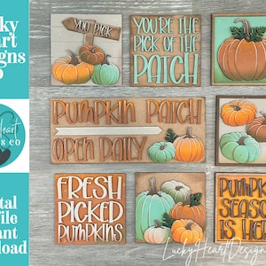 May include: A collection of wooden signs with pumpkin-themed designs. The signs feature phrases like "You Pick," "You're the Pick of the Patch," and "Pumpkin Season is Here." The pumpkins are painted in orange, green, and brown.