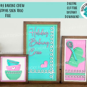 May include: Three wooden signs with a Christmas baking theme. The signs are decorated with a teal, pink, and white color scheme. The text on the signs reads "Holiday Baking Crew".