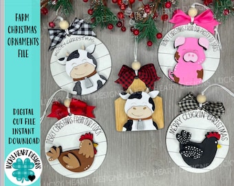 May include: Four round wooden Christmas decorations with a farmhouse theme. Each decoration features a different farm animal: a cow, a pig, a chicken, and a black and white chicken. The decorations are painted in various colours, including white, black, brown, pink, and red. Each decoration has a white background with black horizontal lines and a festive Christmas message.
