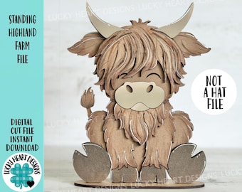 May include: A wooden cutout of a Highland cow standing on a base. The cow is brown and has a long, shaggy mane. The cutout is a digital cut file, not a hat file.