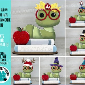 May include: A green bookworm with interchangeable hats, including a graduation cap, a pilgrim hat, a Santa hat, a witch hat, and a birthday hat. The bookworm is holding a stack of books with the text "Welcome to our classroom".
