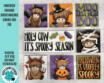 May include: A collection of Halloween-themed Highland cow signs. Each sign features a cartoon cow in various spooky costumes, including a witch hat, mummy wrappings, and devil horns. Text includes "Holy Cow It's Spooky Season" and "Halloween is Udderly Spooky".