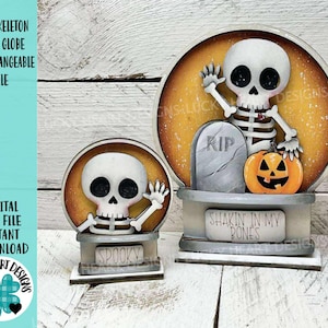 May include: Two Halloween-themed snow globes featuring skeleton figures. One globe has a tombstone and pumpkin, the other says "Spooky". The text on the image reads "Cute Skeleton Snow Globe Interchangeable File" and "Digital Cut File Instant Download".