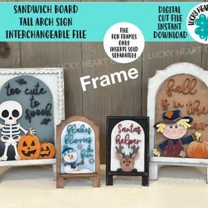 May include: A collection of interchangeable sandwich board signs with seasonal themes. The signs include a skeleton and pumpkins for Halloween, a snowman for winter, a reindeer for Christmas, and a scarecrow for fall. The signs are white with wooden inserts.