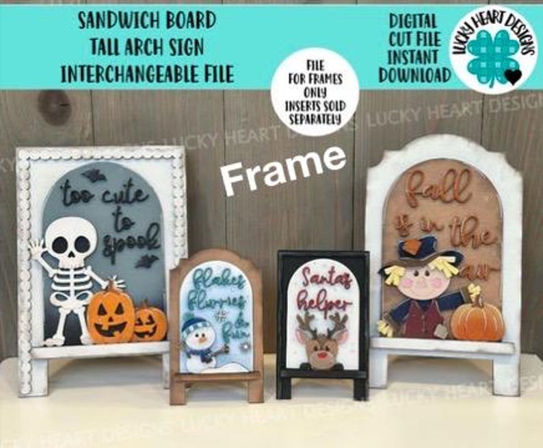 May include: A collection of interchangeable sandwich board signs with seasonal themes. The signs include a skeleton and pumpkins for Halloween, a snowman for winter, a reindeer for Christmas, and a scarecrow for fall. The signs are white with wooden inserts.