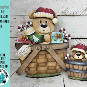 May include: A wooden bear-themed Christmas decoration. The bear wears a Santa hat and sits in a basket with gifts and candy canes. The text on the image says "Bear Christmas for the Flower Basket Interchangeable File".