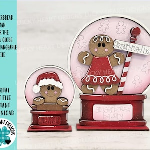 May include: Two snow globe ornaments with gingerbread men. The snow globes are white with pink interiors. The gingerbread men are red and brown. The snow globe on the left has the text "Gingerbread" on the base. The snow globe on the right has the text "Gingerbread Bakery" on the base and a sign that says "Gingerbread Ln."