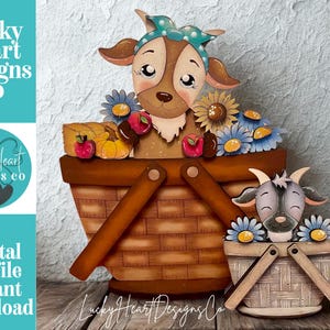 May include: Wooden cut file featuring a large picnic basket with a goat head and flowers, and a smaller basket with a goat head. The image includes the text "Lucky Heart Designs Co" and "Digital cut file instant download".