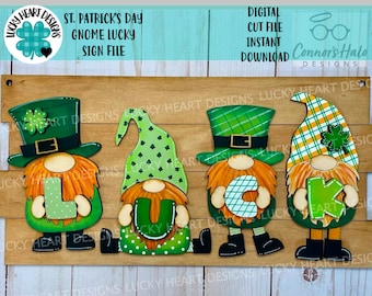 May include: A wooden sign with three gnomes dressed in green and orange, holding letters that spell out "LUCKY". The gnomes are wearing hats with shamrocks and have white beards. The sign is decorated with a wood grain pattern.