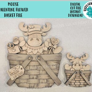 May include: A wooden craft project featuring a moose with a basket of Valentine's Day themed items. The basket is filled with hearts, candy, and a sign that says "I moose be love".