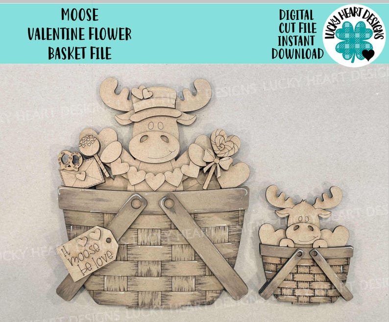 May include: A wooden craft project featuring a moose with a basket of Valentine's Day themed items. The basket is filled with hearts, candy, and a sign that says "I moose be love".
