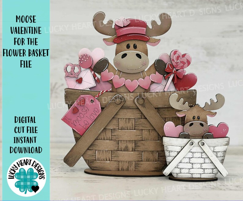 May include: A digital cut file for a Valentine's Day moose in a flower basket. The moose is holding a heart-shaped lollipop and a sign that says "Moose Be Love".