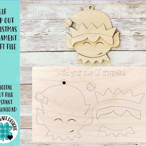 May include: A digital craft file for a pop-out elf Christmas ornament. The file includes a template for the elf's face, hat, and other details. The text "build your own Elf ornament!" is included on the template.