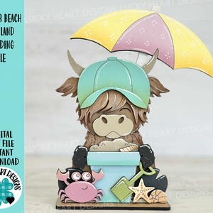 May include: A digital cut file of a Highland cow wearing a green and brown baseball cap and holding an umbrella. The cow is standing in a bucket with sand and a seashell. There is a crab, a starfish, and a seashell on the ground in front of the cow.