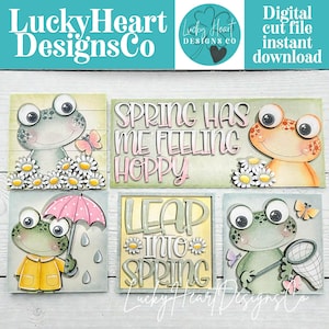 May include: A collection of digital cut files featuring cartoon frogs with spring-themed designs. The designs include frogs with butterflies, umbrellas, and the phrases "Spring Has Me Feeling Hoppy" and "Leap Into Spring."
