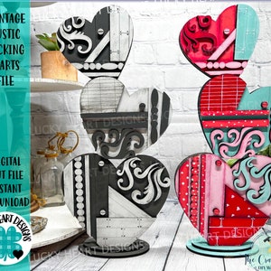 May include: A set of four wooden hearts, each painted in a different pattern of black, white, red, pink, and blue. The hearts are stacked on top of each other, creating a decorative display. The hearts are made of wood and have a rustic, vintage look.