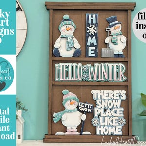 May include: A brown wooden tiered display board featuring interchangeable winter-themed cutouts including three snowmen, a vertical HOME sign, a HELLO WINTER sign, and a sign reading THERE'S SNOW PLACE LIKE HOME with snowflake accents.