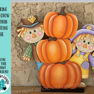 May include: A wooden fall-themed decoration featuring a stack of three orange pumpkins with a scarecrow on each side. The scarecrows have painted faces, hats, and clothing. Text on the left side reads "PEEKING SCARECROW PUMPKIN STANDING FILE".