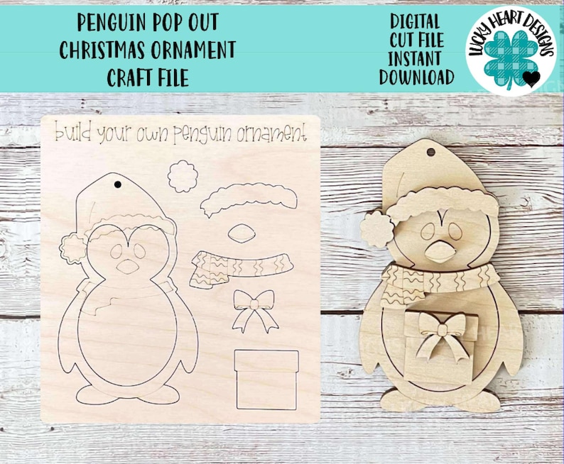 May include: A wooden penguin Christmas ornament craft kit. The kit includes a penguin, hat, scarf, bow, and gift box pieces that can be popped out and assembled. The kit is designed for crafting and decorating.