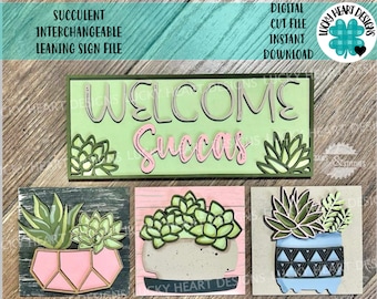 May include: A digital cut file for a welcome sign with interchangeable succulent designs. The sign features the text "Welcome Succas" in pink and green on a green background. The file includes three different succulent designs in pots.