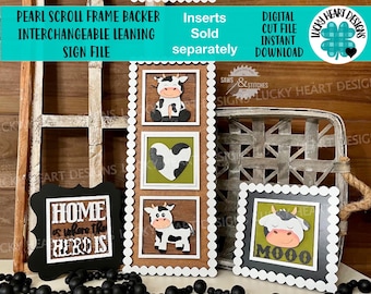 May include: A farmhouse-themed interchangeable sign with a pearl scroll frame. The sign features a black chalkboard with the text "Home is where the herd is" and three interchangeable inserts with cow designs. The inserts are sold separately.