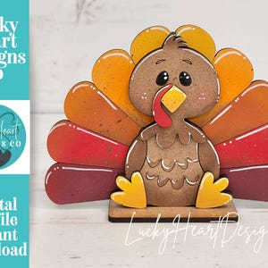 May include: A wooden turkey decoration with a brown body, a red wattle, and a fan of orange, yellow, and red feathers. The base is brown, and the design includes the text "Lucky Heart Designs Co" and "Digital cut file instant download".