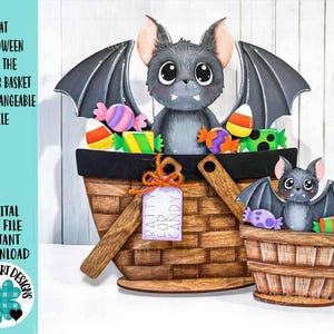 May include: A Halloween-themed decorative basket with a bat design. The basket is filled with colorful candies and features a cute bat with large eyes and wings. The text "BATTY FOR CANDY" is on a tag attached to the basket.