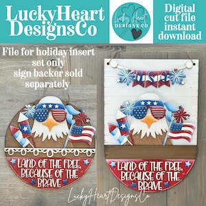 May include: Two wooden patriotic decorations featuring an eagle wearing sunglasses with the American flag design. One is round, the other is rectangular. Both have the text "Land of the Free, Because of the Brave". The text "USA" is on the rectangular one.