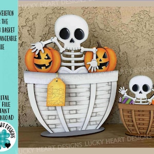 May include: A Halloween-themed decorative set featuring a white skeleton figure with black eyes, holding two orange jack-o'-lanterns, and a smaller skeleton in a basket. The set includes a large white basket and a smaller brown basket. Text on the image reads "CUTE SKELETON FOR THE FLOWER BASKET INTERCHANGEABLE FILE".