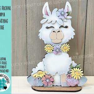 May include: A white wooden llama figurine with a floral crown and a floral necklace. The llama is standing on a wooden base with flowers and leaves around it. The text "SPRING FLORAL LLAMA STANDING FILE" is in the top left corner of the image.