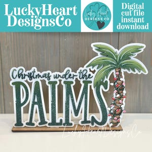 Puede incluir: Decoración navideña de madera con una palmera con luces de cadena y la frase "Christmas under the PALMS". El diseño incluye un logotipo y el texto "Digital cut file instant download".