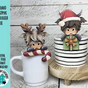May include: Two Highland cow mug huggers, one with reindeer antlers and a candy cane, the other with a Santa hat and a gift. The mugs are white and black striped. Text on the left reads "HIGHLAND CHRISTMAS MUG HUGGER FILE" and "DIGITAL CUT FILE INSTANT DOWNLOAD".