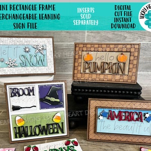 May include: Four interchangeable wooden signs with different seasonal themes. The signs are brown with a wood grain texture and have a white background. The signs feature the text "Let it Snow", "Hello Pumpkin", "Broom Parking Happy Halloween", and "America The Beautiful".