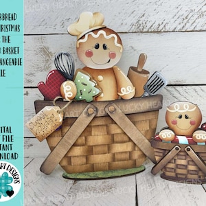 Puede incluir: Un hombre de jengibre de madera con un gorro de chef en una cesta llena de utensilios para hornear y galletas. Una cesta más pequeña con un hombre de jengibre y un bastón de caramelo está al lado. El texto dice "Gingerbread Cute Christmas".