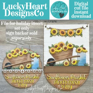May include: Two wooden sign designs featuring a wheelbarrow filled with yellow sunflowers and a blue milk can. The signs display the text Sunflower Market PICKED FRESH DAILY. The circular sign has a white scalloped border, while the oval sign has a banner.
