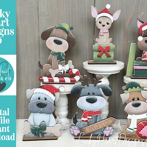 May include: Wooden Christmas dog figurines in various poses, wearing Santa hats, scarves, and reindeer antlers. Some dogs sit atop gift boxes or hold festive items. The image includes the text "Lucky Heart Designs Co" and "Digital cut file instant download."