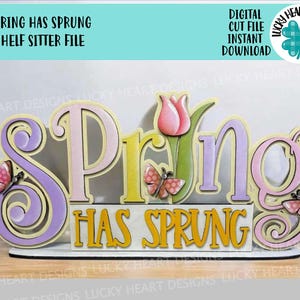 May include: A wooden shelf sitter with the words "Spring Has Sprung" in layered pastel colors. The design includes a tulip, butterflies, and the text "Digital Cut File Instant Download". The Lucky Heart Designs logo is in the upper right corner.