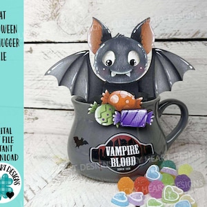 May include: A gray mug with a bat-shaped Halloween mug hugger, filled with colorful candies. The mug has a "Vampire Blood" label. The image includes the text "Bat Halloween Mug Hugger File" and "Digital Cut File Instant Download."