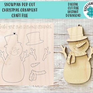 May include: A digital cut file for a snowman pop-out Christmas ornament craft. The file includes a snowman with a hat, scarf, carrot nose, and twig arms. The file is for instant download.
